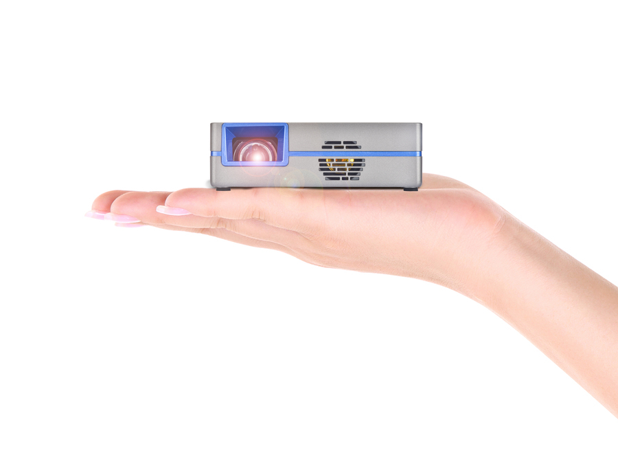 AAXA SLC450 Short Throw Smart Projector held in a hand